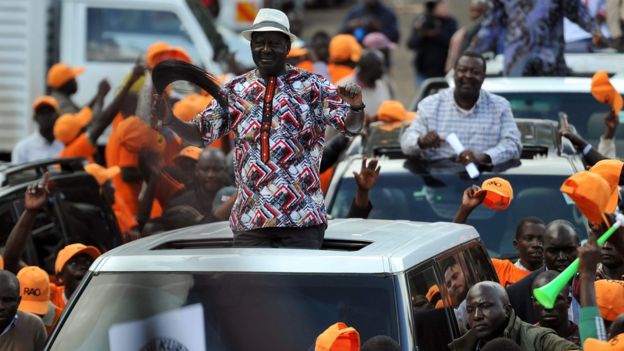 Raila Odinga, leader of the National Super Aliance (NASA), waves to supporters from a car in Nairobi, 25 October 2017