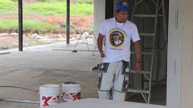 A former Farc rebel works on the construction of the planned hotel