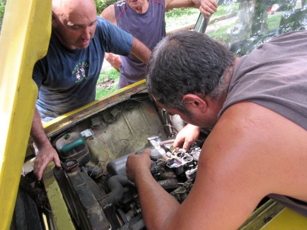 Man fixing a carburettor
