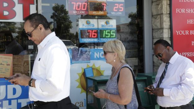 People wait outside a liquor store to buy lottery tickets in Hawthorne, California