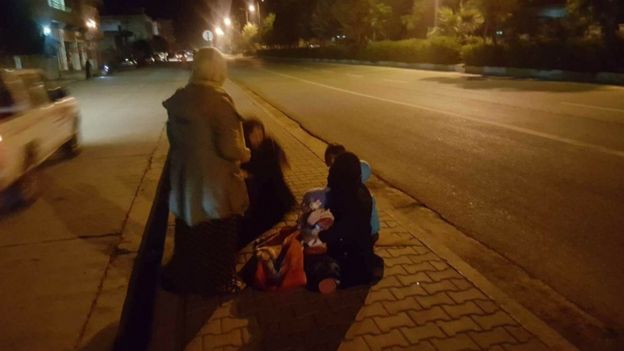 Three Baghdad residents in the streets after a powerful earthquake struck