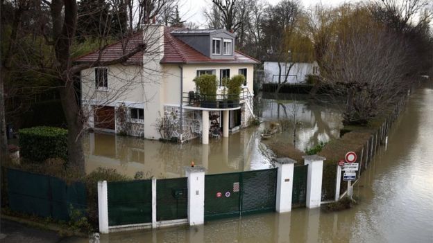 A photo taken on 29 January 2018 shows a house surrounded by floodwater from the Seine river in Bougival, west of Paris