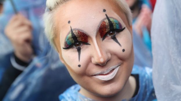 Supporters of gay rights, including a young woman wearing glitter, celebrate following a vote at the nearby Bundestag in which parliamentarians approved a new law legalising gay marriage in Germany on 30 June 2017 in Berlin