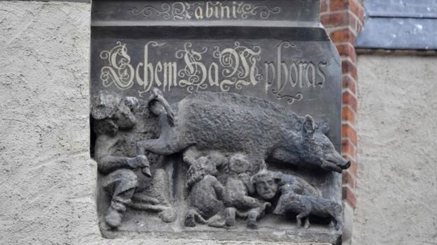 A medieval anti-Semitic carving depicting Jews suckling the teats of a sow as a rabbi looks intently under its leg and tail is pictured at the Stadtkirche (Town and Parish Church of St Mary's) in Wittenberg, eastern Germany.