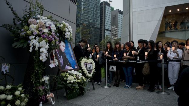 People hold candles as they pay their respect to the late Leslie Cheung Kwok-wing, opposite to the Mandarin Oriental Hotel, during a remembrance on the 10th anniversary of his death, in Hong Kong on April 1, 2013.