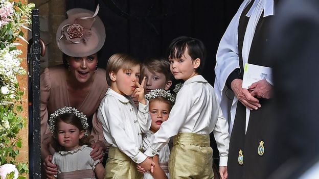 Duchess of Cambridge stands with her daughter, Princess Charlotte, and the other bridesmaids and page boys