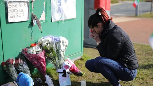 A woman grieves outside Alder Hey Hospital