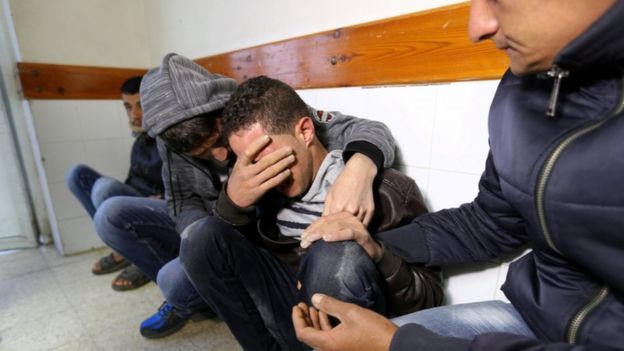 Relatives of the dead Palestinian grieve at a hospital in southern Gaza