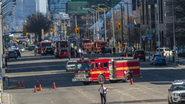 Toronto police and emergency crews can be seen along Yonge Street in northern Toronto, Canada, 23 April 2018
