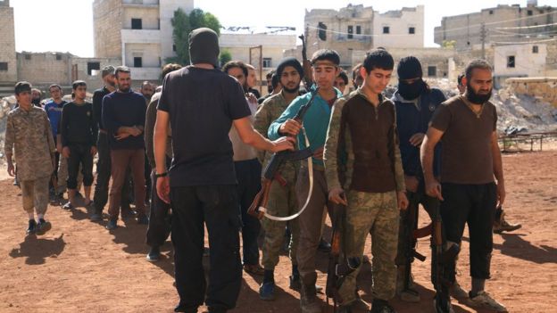 Rebel fighters part of the Jabhat Fateh al-Sham, attend military training in the besieged rebel held Aleppo