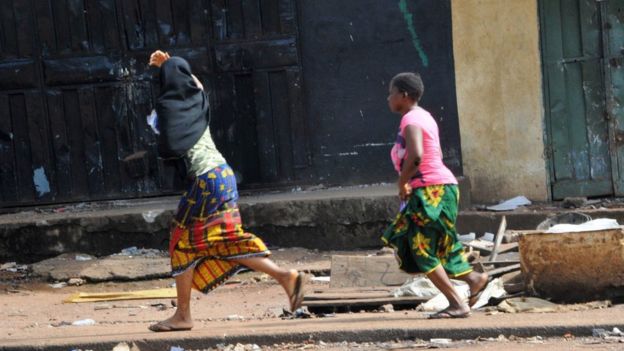 Two women run in pre-election clashes in Guinea
