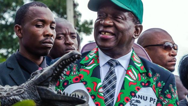 President Emmerson Mnangagwa being presented with a carving of a crocodile - December 2017