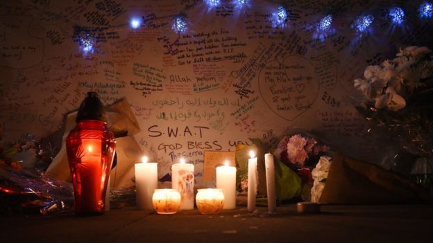 Candles and messages of condolence near where the fire broke out at Grenfell Tower