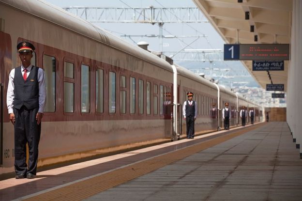 Chinese employees of the Addis Ababa / Djibouti train line stand at the Feri train station in Addis Ababa on 24 September 2016.