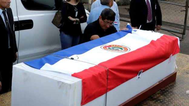 Feliciano Encina, father of Gustavo Encina, Paraguayan pilot of the crashed plane that carried the Brazilian team Chapecoense, cries next to the coffin of his son at the Silvio Pettirossi International Airport in Luque, Paraguay 2 December 2016.