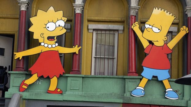 Lisa Simpson and Bart Simpson cut-outs on display at 'The Simpsons' 350th episode block party on the New York street of Fox Pico Lot on April 25, 2005 in Los Angeles, California.