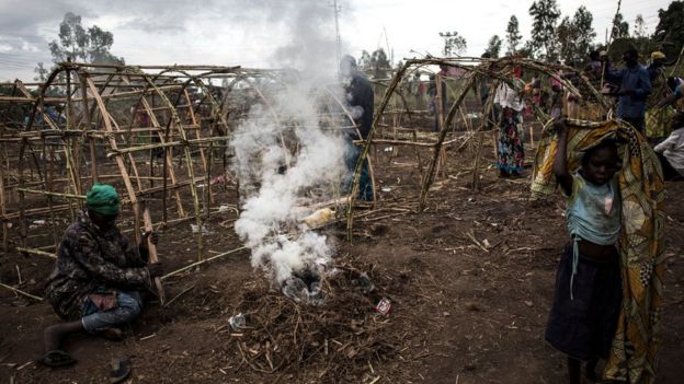 Internally Displaced Congolese construct makeshift shelters in a camp for displaced people on 27 February 2018 in Bunia.