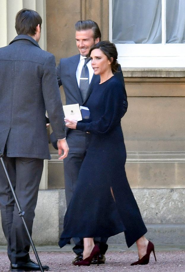 Victoria and David Beckham outside of Buckingham Palace after she received her OBE