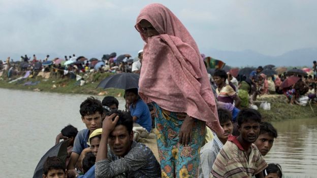 Displaced Rohingya refugees from Rakhine state in Myanmar rest near Ukhia, near the border between Bangladesh and Myanmar, as they flee violence on 4 September 2017