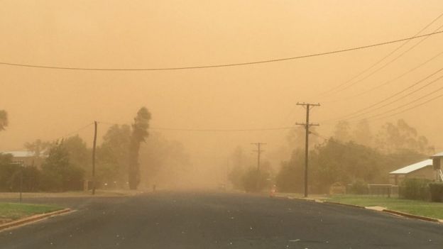 A dust storm covers a street in Charleville, Queensland