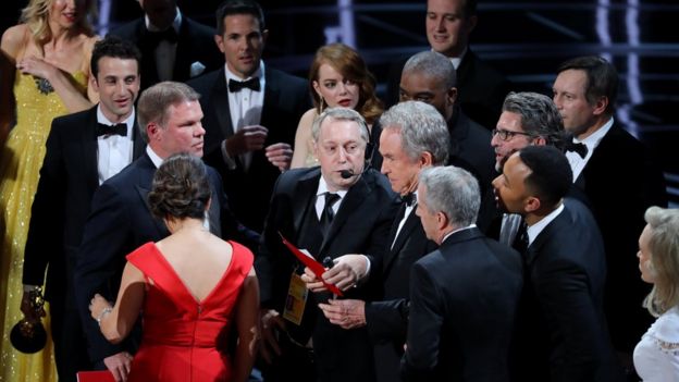 Warren Beatty holds the card for the Best Picture Oscar