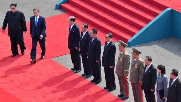 Kim Jong-un and Moon Jae-in walk on a red carpet ahead of historic talks