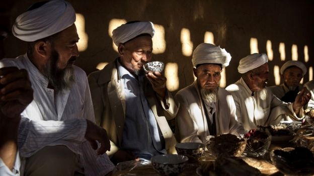 Uyghur men at a festive meal