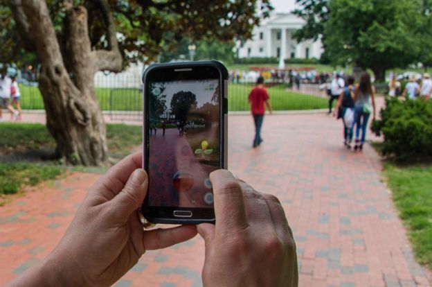 A Pokemon player searches the square in front of the White House
