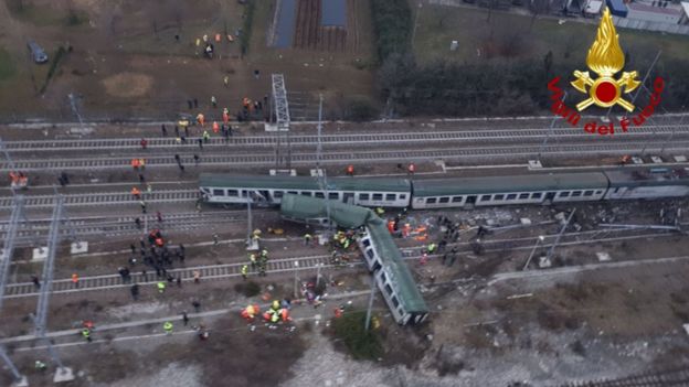 This handout picture released by the Italian Vigili del Fuoco shows firemen working on the site of a train derailment