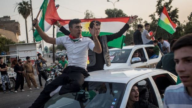 Kurds celebrate on the streets after voting in an independence referendum in Kirkuk, Iraq, on 25 September 2017
