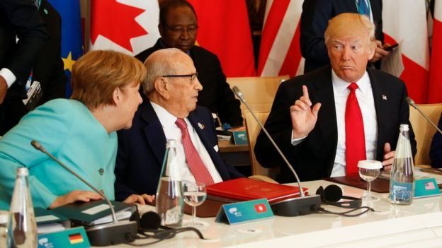 Trump con Merkel en la reunión del G7.