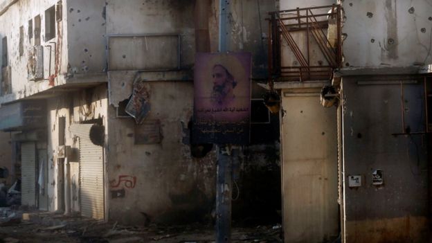 A poster mourning the executed cleric Sheikh Nimr al-Nimr hangs on a lamppost in Awamiya, Saudi Arabia (9 August 2017)