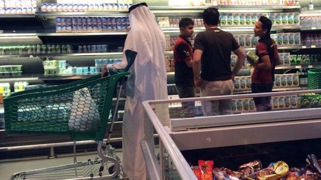 Customers are seen shopping at the al-Meera market in Doha on 10 June 2017