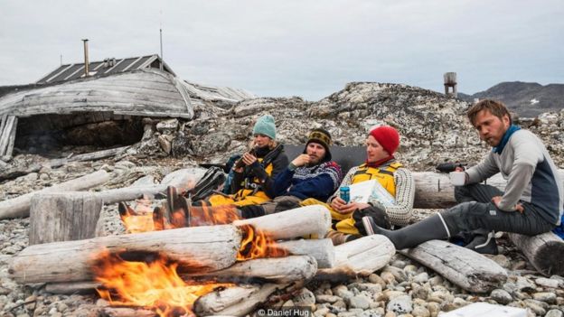 A driftwood bonfire on a lonely beach in northwest Svalbard