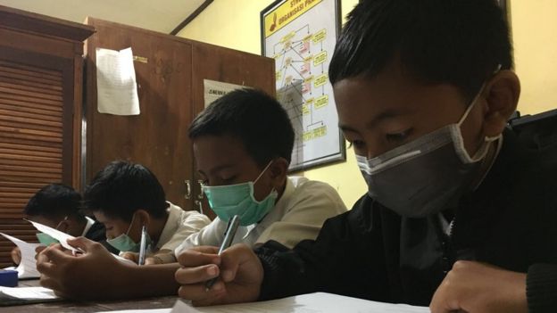 Bali students wearing face masks