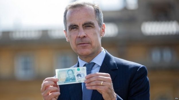 Mark Carney with the UK's new £5 note