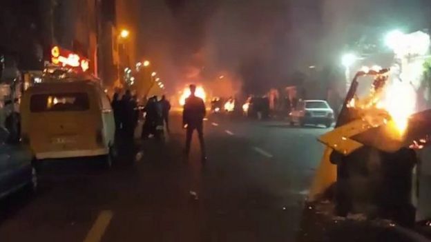 Nighttime photo shows fires in a Tehran street