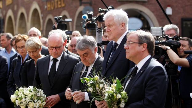 Muenster Mayor Markus Lewe, North Rhine Westphalia (NRW) Internal Affairs Minister Herbert Reul, German Interior Minister Horst Seehofer and NRW Minister-President Armin Laschet mourn at the site where, on April 7, a man drove a van into a group of people sitting outside a popular restaurant in the old city centre of Muenster.