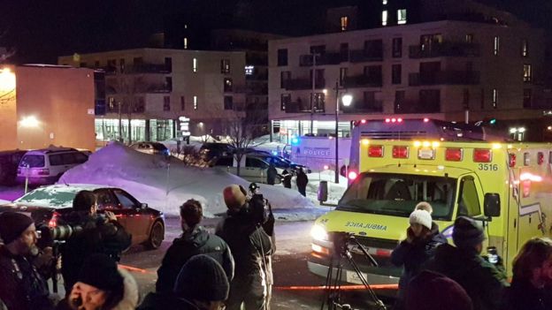 An ambulance is parked at the scene of a fatal shooting at the Quebec Islamic Cultural Centre in Quebec City, Canada January 29, 2017.