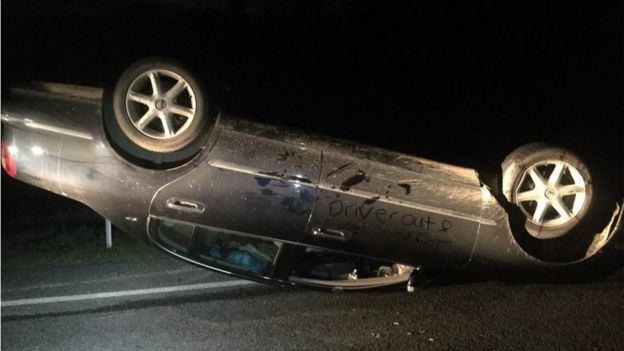 Picture of overturned car in aftermath of 13 November earthquake in New Zealand