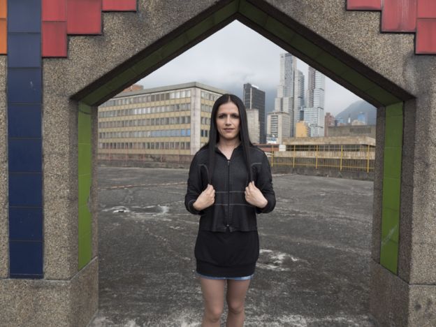 A woman who calls herself Andrea poses on the rooftop of Galax mall, where Tranxtienda is locates