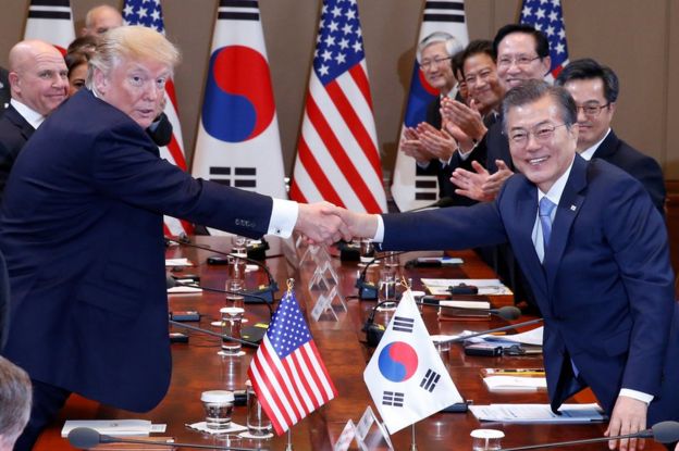 U.S. President Donald Trump and South Korea's President Moon Jae-in shake hands before the summit meeting at the Presidential Blue House in Seoul, South Korea, November 7, 2017.