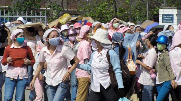 Vietnamese workers are seen as they go on strike at the Keyhinge Toy plant in the central city of Da Nang, 30 January 2008