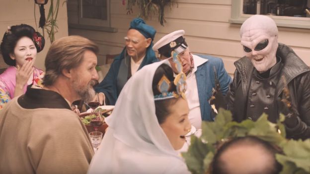 A still from a lamb advert depicting various religious figures sharing a meal