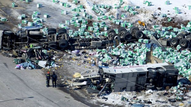 Aerial photograph of wreckage shows lorry's load scattered in the snow, highly damaged bus and overturned trailer