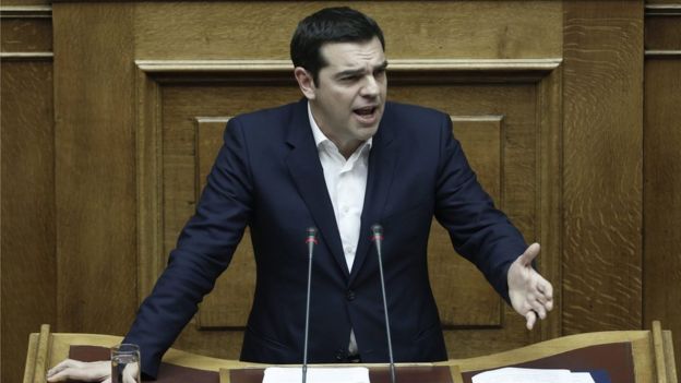 Greek Prime Minister Alexis Tsipras addresses lawmakers during a parliamentary session prior to a budget vote in Athens