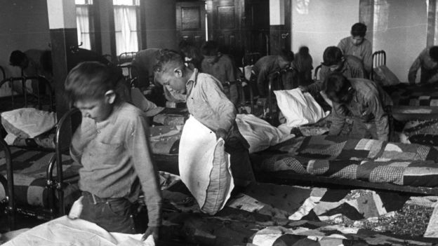 1950: North American Indian children in their dormitory at a Canadian boarding school. (Photo by Hulton Archive/Getty Images)