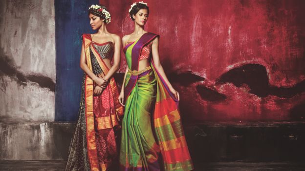 Models wearing Nalli saris