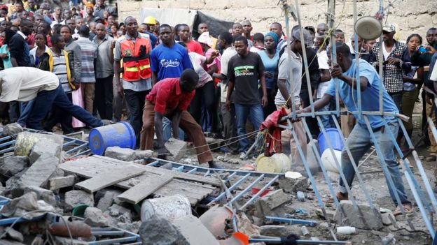 Emergency personnel at the scene of a collapsed building in a residential area of Nairobi, 13 June 2017