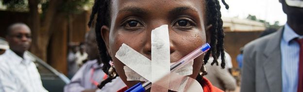 Woman with mouth taped up